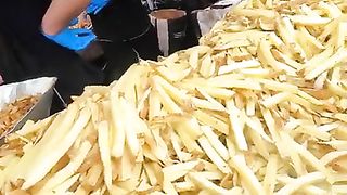 Mountain of French Fries, Chips, Fried Potatoes. London Street Food