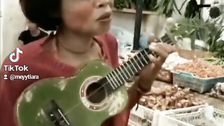 Pengamen pasar
