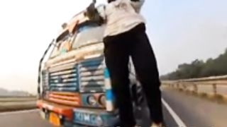What Could Go Wrong? Man Stands On A Motorbike Right Next To A Truck And Then This Happens!