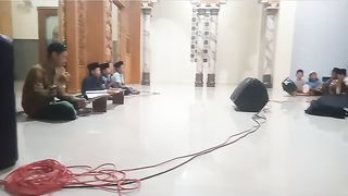 reciting the Koran at the village mosque