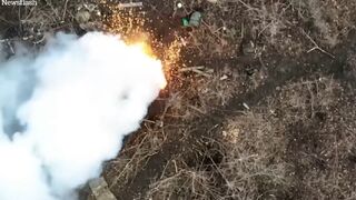 Russian soldiers catch fire as Ukrainian drones drop bombs on foxholes