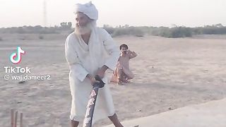Old men playing cricket