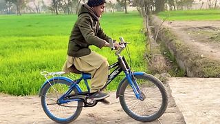 Village boy cycling