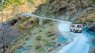 Ajk view with jeep on road with song