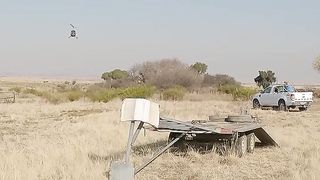Pilot Land Helicopter Neatly On Trailer.
