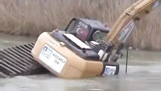 Excavator in Lake.