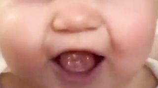 Cute baby playing with the dog 2
