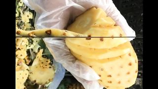cutting pineapple