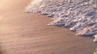 Close Up Waves In Slow Motion On The Shore