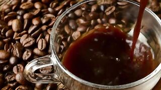 Pouring Black Coffee In A Cup
