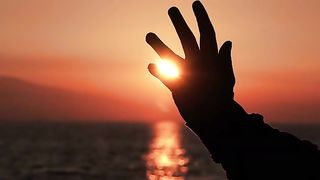 Silhouette Of Hand At Sunset Sun