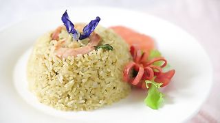 Rotating Shrimp Fried Rice On A White Plate
