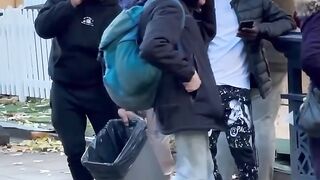 Giving stranger a rubbish bin in his hand ????????????????