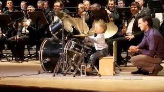 A little boy rocks out on the drums
