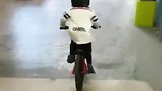 Riding at an indoor skatepark - practicing jumping my bike!