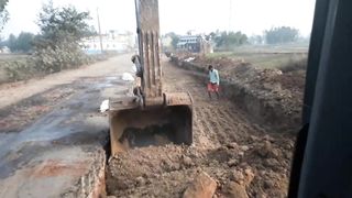 Volvo_210_excavator_working_for_Road_cutting