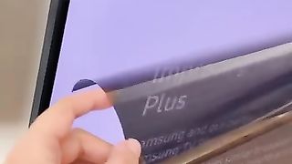 The girl took off the cover of the TV screen, mistaking it for a protective film