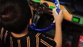 funny video of a boy playing a car game.