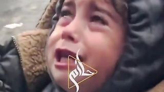 A child from Gaza cries because she cannot get food.