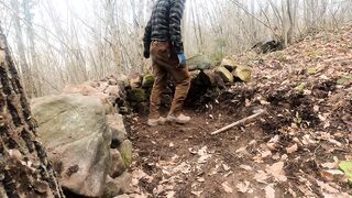 Fireplace Inside Survival Shelter Made of Stone and Wood