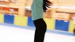 This woman is very beautiful, she does ice skating perfectly.