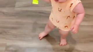 Baby playing with adog