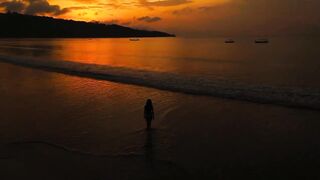 Silhouette of Girl walking in sunset