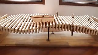 This kinetic wave sculpture is made from mostly all wood.