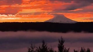 gorgeous view of a fiery sunrise near Mount Rainier, Washington.