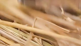 Homemade Eco-friendly Sandals made of straw  in a beautiful village by a beautiful girl