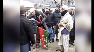 Captain Safdar kisses the child carrying the PTI flag
