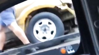 Guy takes his truck back off of a moving tow.