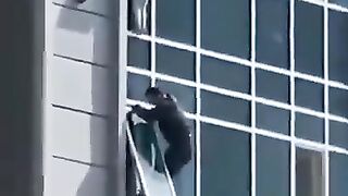 Neighbor saves a dangling kid.