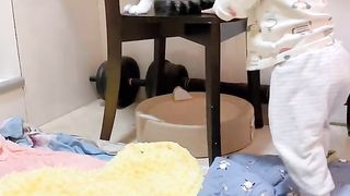 Baby playing with cat