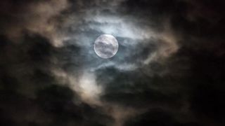 Moon and clouds in the night sky