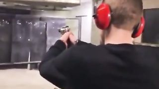 Footage shows a man at the firing range almost shooting himself by accident.