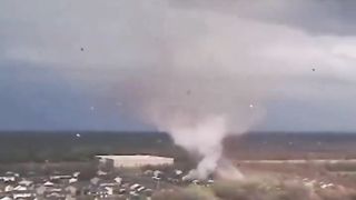 Tornado forms over town ripping homes apart