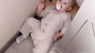 baby using dog as pillow