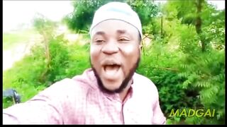 african guy running away from tribe member but with sponge bob music