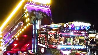 big trucks with lots of flashing lights that are very busy