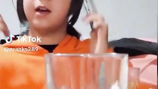 Girl spinning something on her nose