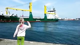 Girl honks at ship