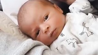 Baby in father's embrace
