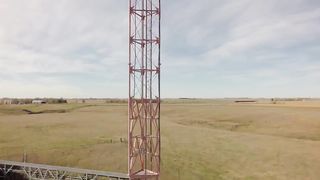 Someone needs to change the light bulb on top of these tall TV towers!