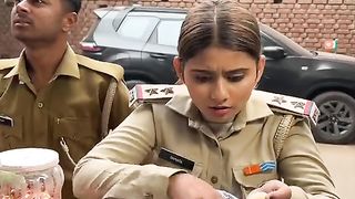 What is there in the sack of rice that the policewoman is not ready to give?