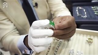 Jacob & Co shows uncut rough diamond and emerald one of a kind ring.