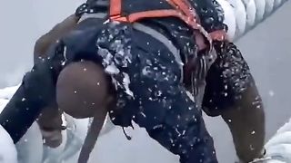 Massive respect to all the workers out in this weather. This electrician's job helping to restore power isn't for the faint hearted.