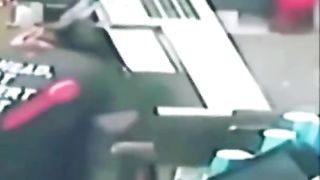 A woman's hair gets pulled into a machine at a fast food restaurant.