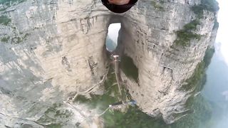 In 2011 GoPro filmed Jeb Corliss gliding through Tianmen Cave using a wing suit