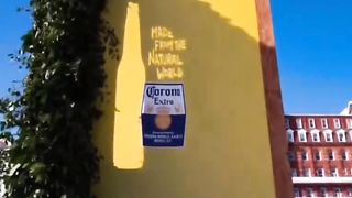 Corona's natural billboard uses sunlight to create the shape of its bottle and label.